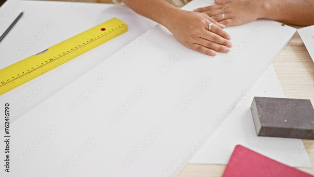 Craftswoman at work, young hispanic woman's hands deftly measuring wood plank in her carpentry workshop, marking future furniture masterpiece Craftswoman at work, young hispanic woman's hands deftly measuring wood plank in her carpentry workshop, marking future furniture masterpiece