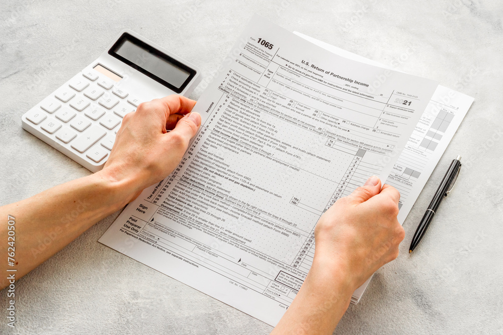 US tax forms on the table. Taxes calculating. Business and finance concept US tax forms on the table. Taxes calculating. Business and finance concept