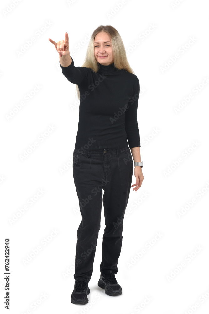 front view of a woman showing the horns sign with fingers looking at camera on white background front view of a woman showing the horns sign with fingers looking at camera on white background