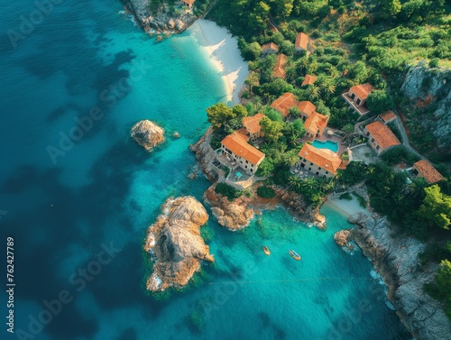 Drone photography showcasing an exotic island retreat amidst azure seas and rich flora, perfect for travel agencies