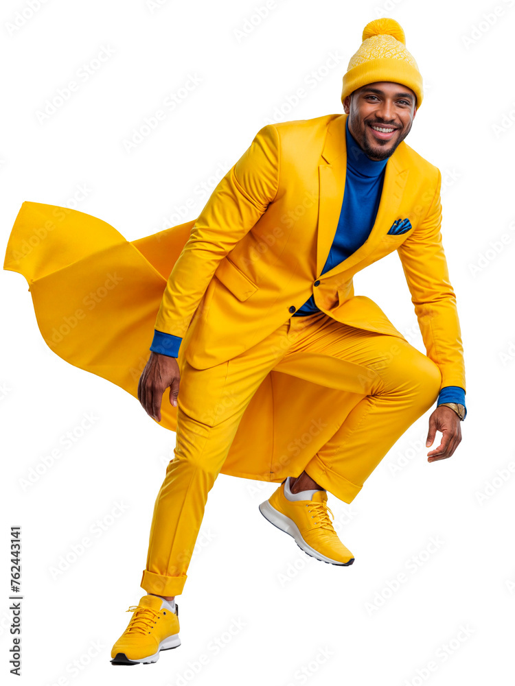 A man in a yellow suit and hat poses in a studio. A man in a yellow suit and hat poses in a studio.