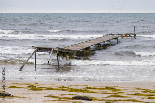 Damaged pier after flood storm in Ishoj Denmark 20 October 2023 Koge bugt, photo