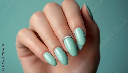 Manicure with Mint Green Nail Polish and Ring