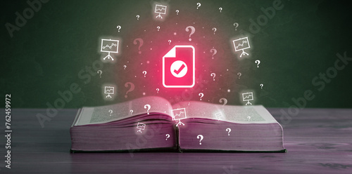 Open book with business icons above