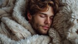 Young Man Sleeping Under Blanket