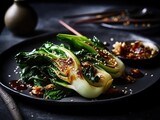 Baked bok choy or pak choi seasoned with soy sauce and roasted sesame seeds. Asian cabbage dish. gourmet lunch