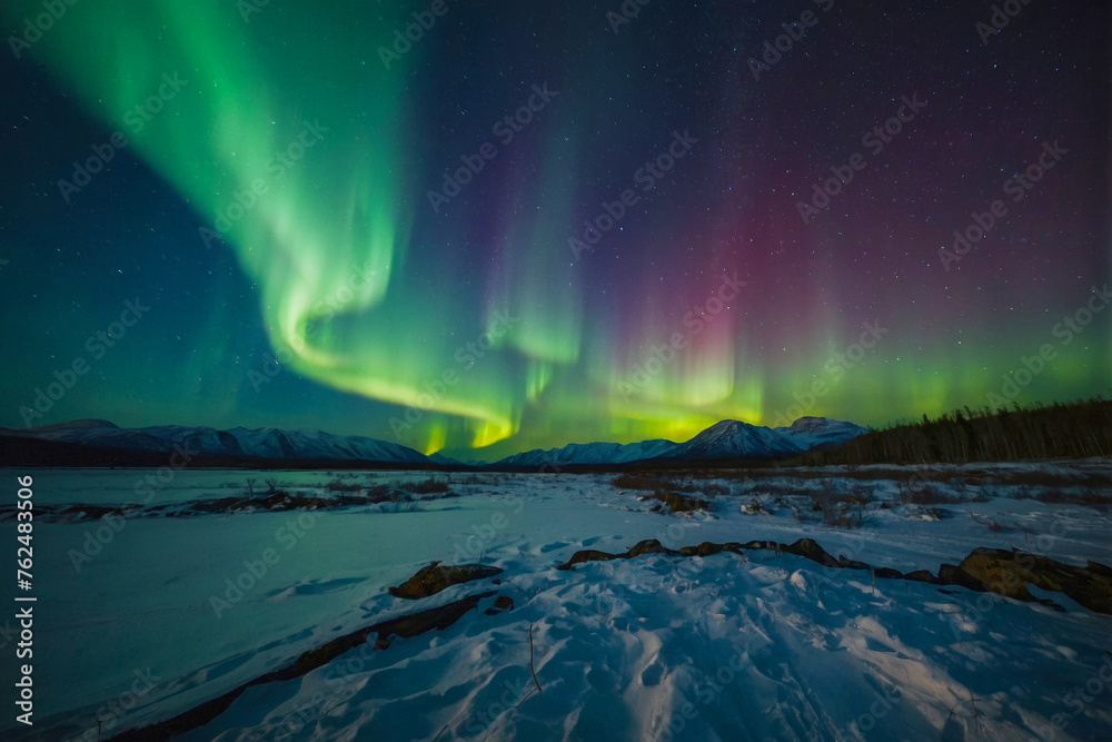 Northern lights at night. Scene is serene and peaceful, as the natural beauty of the auroras