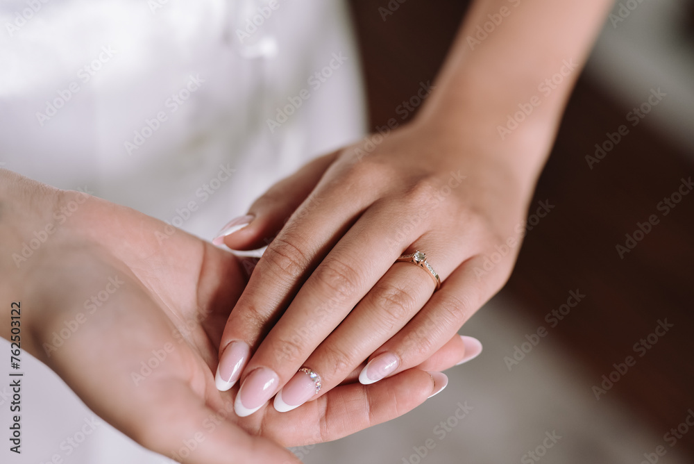 hands of the bride with a ring hands of the bride with a ring