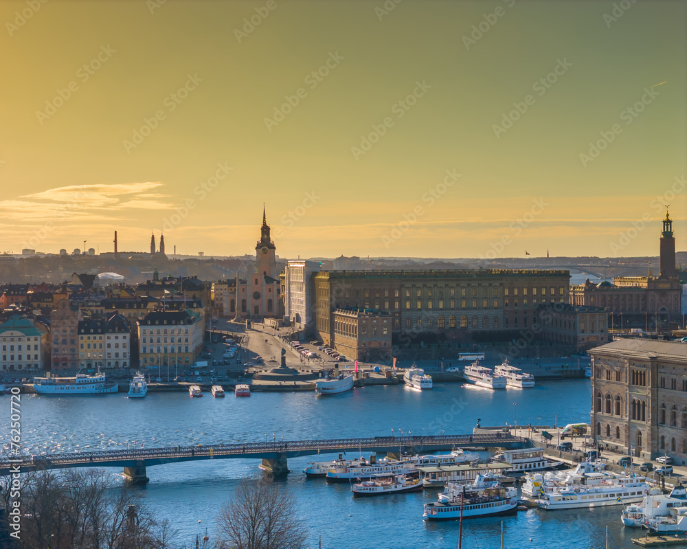 Naklejka premium Stockholm old town - Gamla stan during a sunset. Aerial view of Sweden capital. Drone top panorama photo