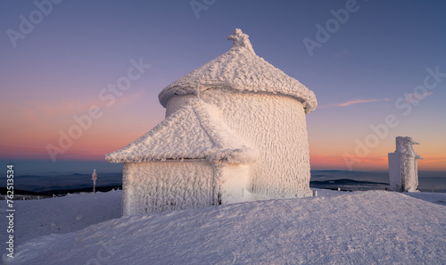 chapel on Sniezka peak during sunset in winter time in Giant mountains 