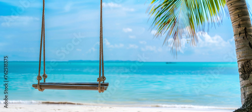 Rocking chair on a palm tree with a turquoise beach in the background © Oleksandr