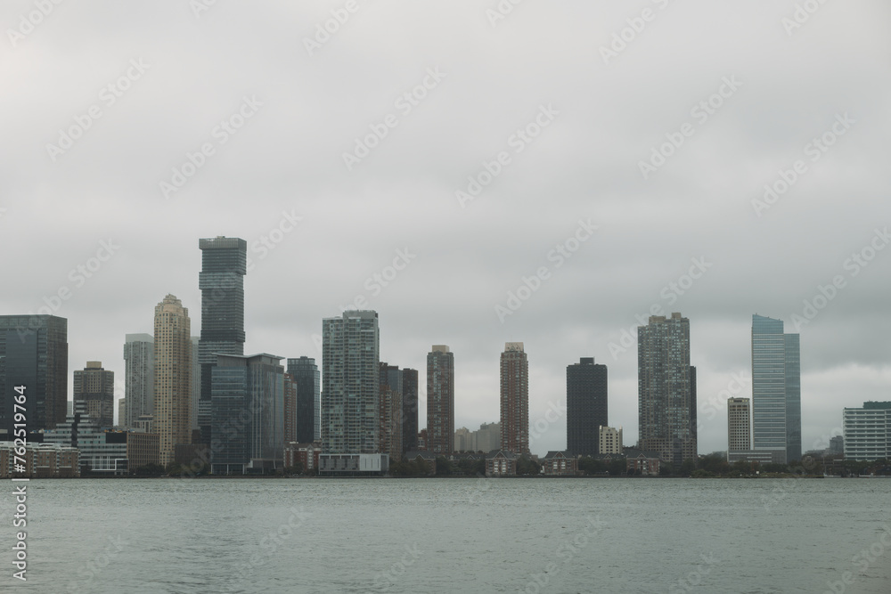 Cloudy Skyline View of New York City's Waterfront Architecture
