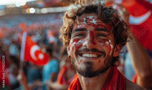 Vibrant Portrait of a Joyful male Turkey Supporter with a Turkish Flag Painted on His Face, Celebrating at UEFA EURO 2024