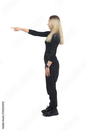 side view of a blonde woman pointing finger front on white background