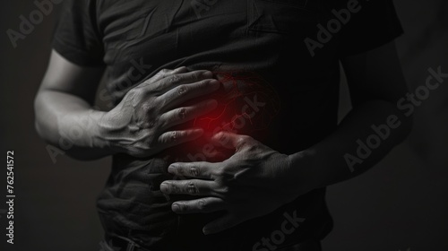 Man holding his stomach with liver in hand and area highlighted in red