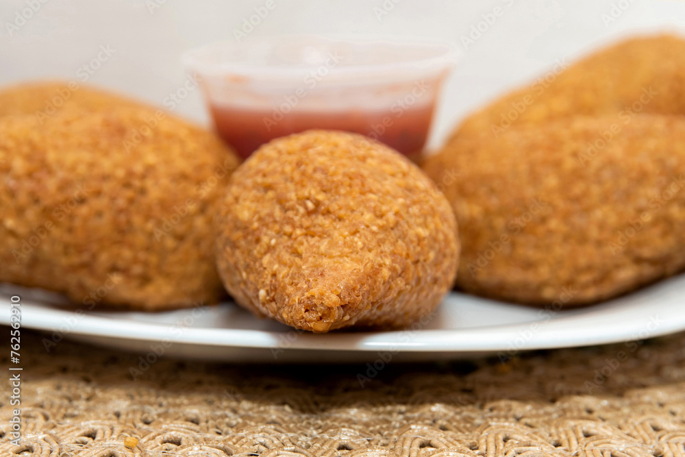 Kibbet Lebanese food, traditional Arabic snack, Kibbe is a fried recipe filled with minced meat, which is characterized by its ovoid shape finished with two pointed ends. Kibbet Lebanese food, traditional Arabic snack, Kibbe is a fried recipe filled with minced meat, which is characterized by its ovoid shape finished with two pointed ends.