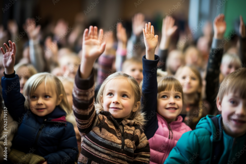 Group of children are in classroom, with some of them raising their hands. Scene is one of excitement and enthusiasm, as children are likely participating in fun activity or event