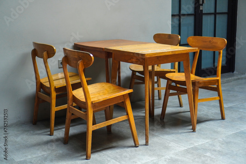 simple minimalist wooden table and chairs for sitting and drinking coffee in a coffee shop photo