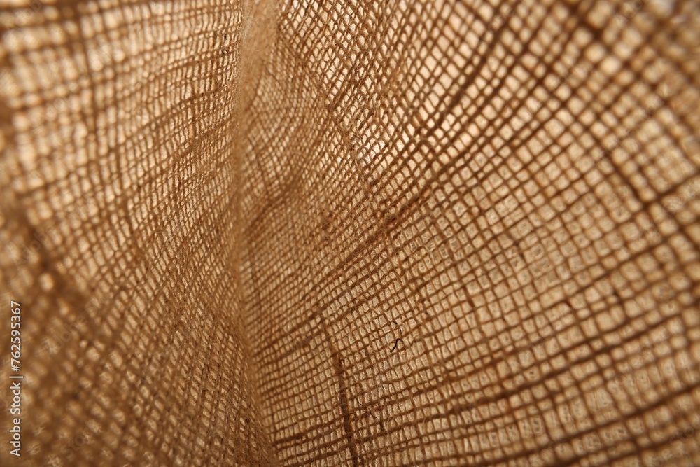 Fototapeta premium Texture of natural burlap fabric as background, closeup