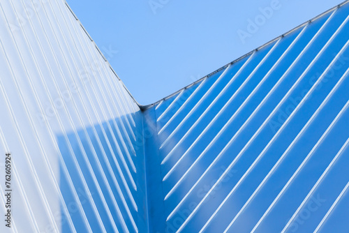 New roof corner made of stainless steel plates, abstract photo