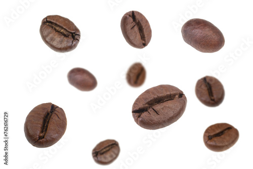 Falling coffee beans isolated on white background. Flying defocused coffee beans. Applicable for cafe advertising, packaging, menu design.