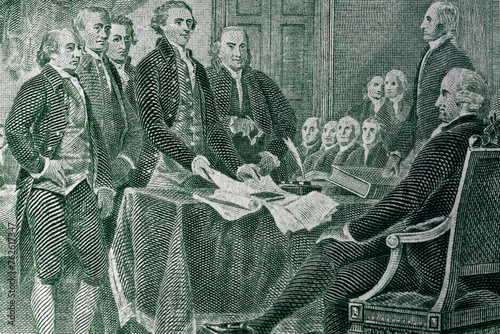 The process of signing the US Declaration of Independence July 4, 1776 on a dollar bill