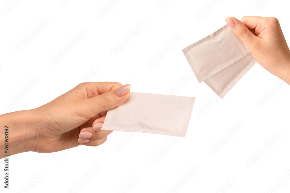 Wet wipe in a woman hand isolated on a white background. Wet wipe in a woman hand isolated on a white background.