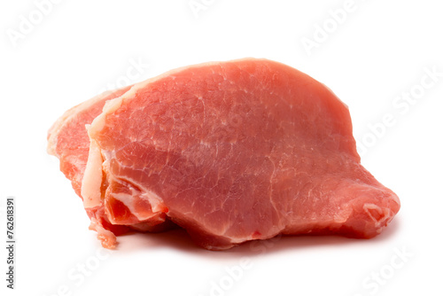 Raw pork pieces isolated on a white background.