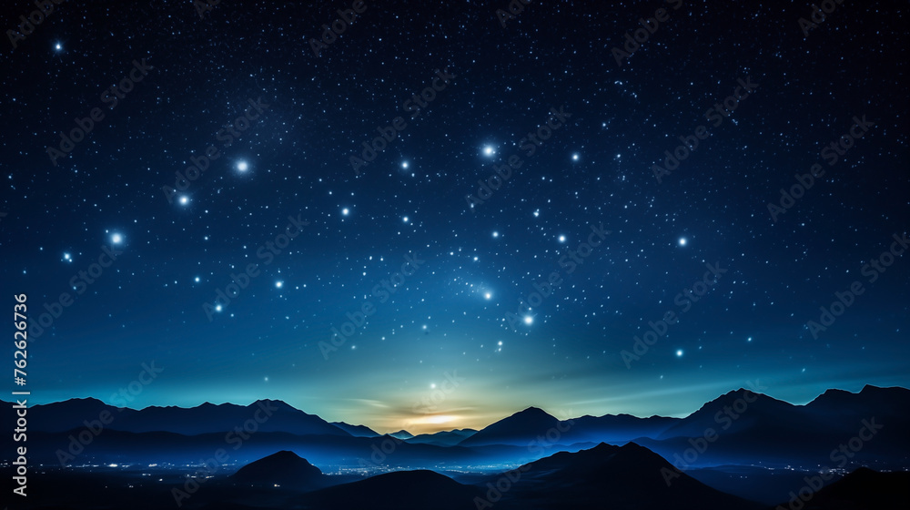 Starry background as twilight descends on mountainous landscape Starry background as twilight descends on mountainous landscape