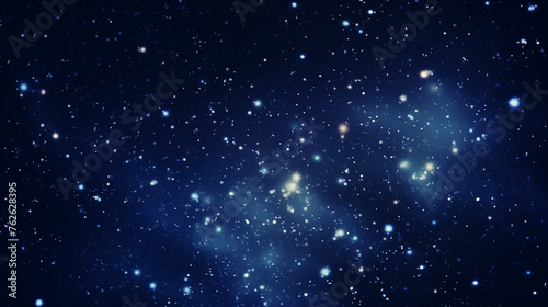 Deep blue starry background with diffused celestial light and cosmic haze
