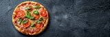 Rustic pizza on black background with tomato, cheese, and italian flavors   fast food concept