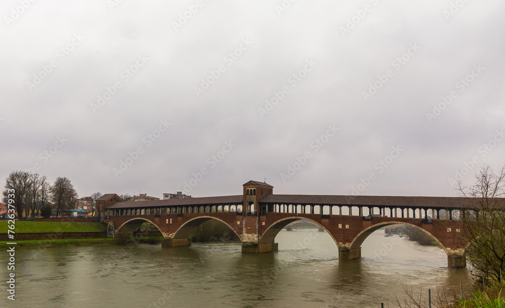 Ponte Coperto (Covered bridge) over river Ticino in Pavia, Italy on a rainy day