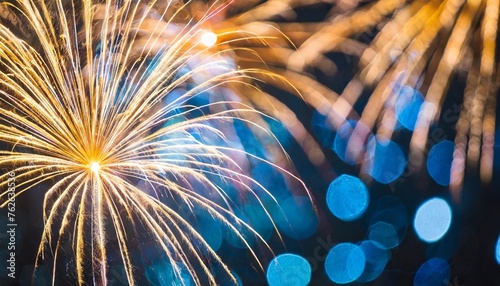 abstract background gold and blue bokeh light with firework © Faith