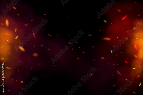 Fire sparks on a black background. Burning glowing particles in red bonfire smoke. Flame sparkles