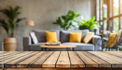 empty wooden table top on blurred living room interior background