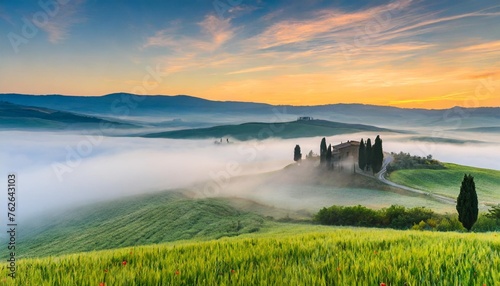 fairytale misty morning in the most picturesque part of tuscany val de orcia valleys photo