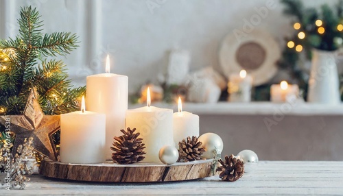 home christmas decor with burning candles in whte interior