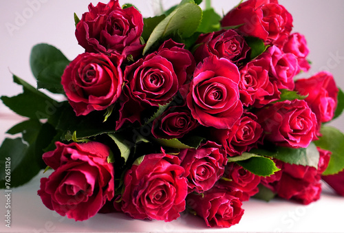 a bouquet of beautiful fresh red roses on a white background