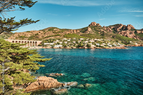 beautiful red cliffs of the rocky coastline of the mediterranean sea of the french riviera near Antheor during sunset.