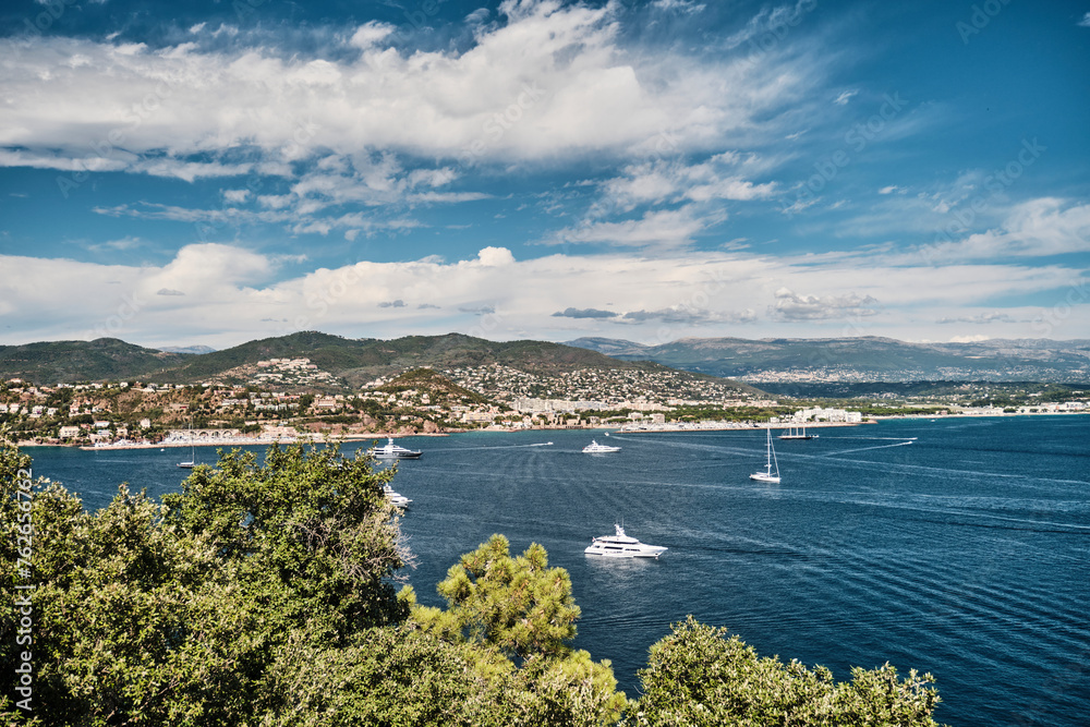 Beautiful coastline of the mediterranean sea at the french riviera of the cote d Azur on aunny day with yachts and sailboats.