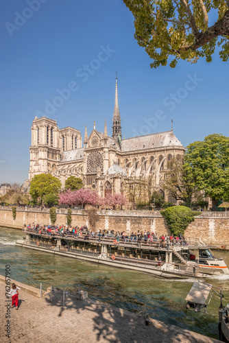 Paris, Notre Dame cathedral with boat on Seine in France