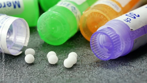 Homeopathy homeopathic medicine globules pills bunch of tubes macro closeup photo