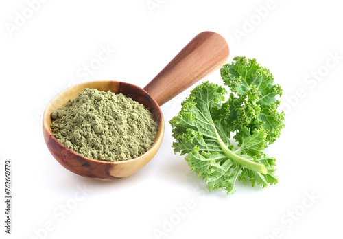 Kale leaves and powder on white background