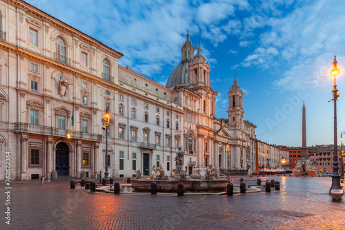 The famous fountains with tritons in Piazza Navona in Rome at dawn.
