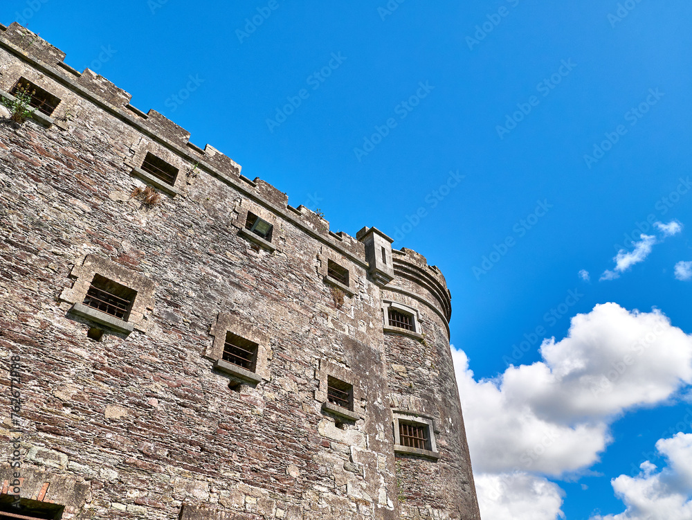 Old celtic castle tower and a house. Ancient Irish architecture background Old celtic castle tower and a house. Ancient Irish architecture background