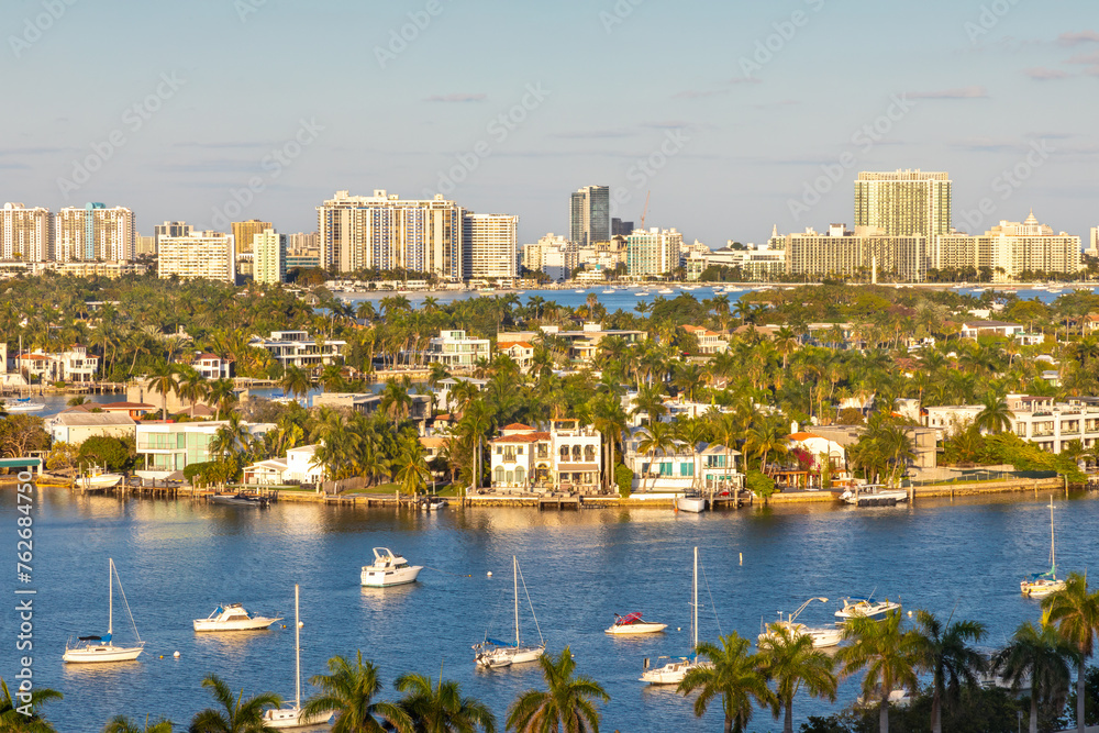 Naklejka premium Beautiful Palm Island in Miami Florida during golden hour on a beautiful day near South Beach