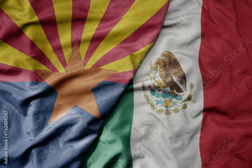 big waving realistic national colorful flag of arizona state and national flag of mexico .