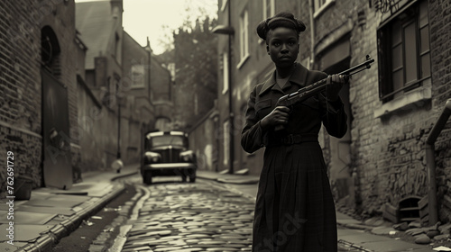 
A black woman in her thirties, dressed in a long dark dress and holding a rifle, stands on a cobblestone street in London during WW2, with a car driving by, captured in a dark cinematic shot.