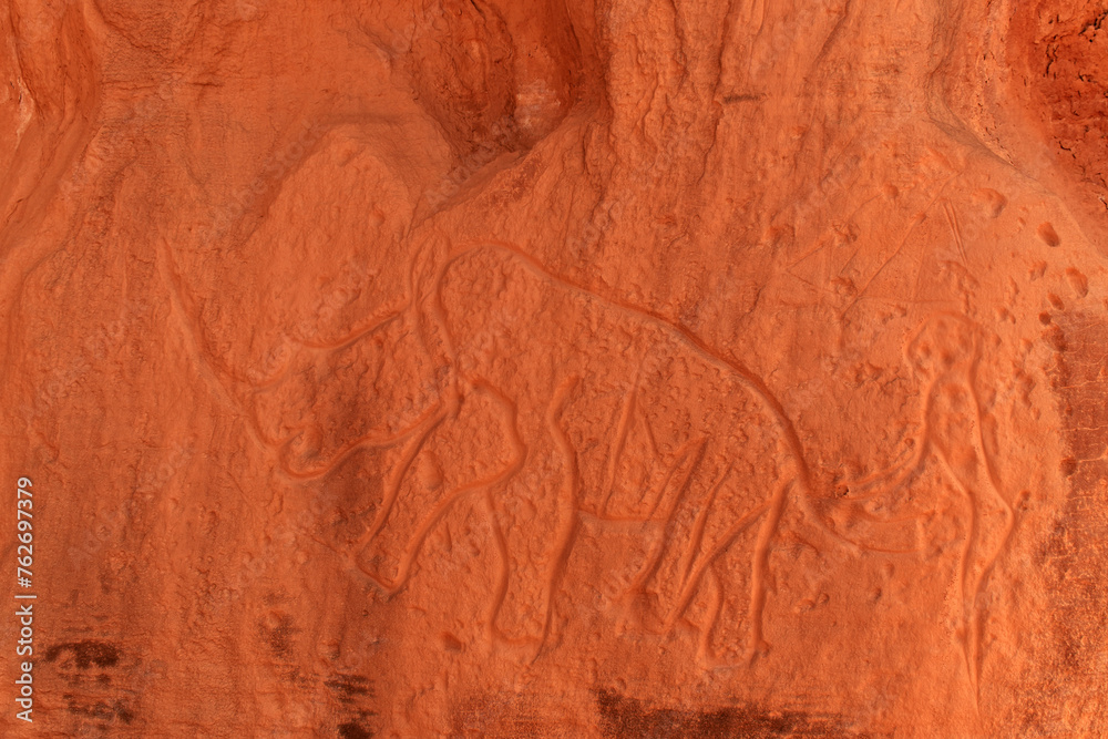 Naklejka premium Rhino - prehistoric petroglyphs, rock art in Tadrart Rouge, Tadrart Akkak, Sahara, Algeria, horizontal view