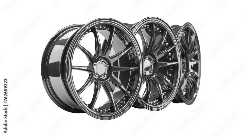 Four chrome wheels gleaming against a white backdrop